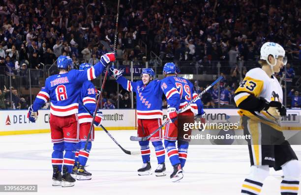 The New York Rangers celebrate a second period goal by Chris Kreider against the Pittsburgh Penguins in Game Two of the First Round of the 2022...