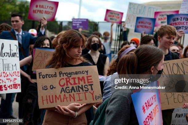 Abortion rights activists attend a rally in front of the U.S. Supreme Court building on May 05, 2022 in Washington, DC. Protestors on both sides of...