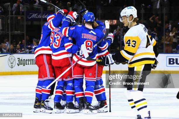 The New York Rangers celebrate a second period goal by Chris Kreider against the Pittsburgh Penguins in Game Two of the First Round of the 2022...