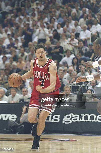 Guard Toni Kukoc of the Chicago Bulls dribbles the ball down the court during a playoff game against the Utah Jazz at the Delta Center in Salt Lake...