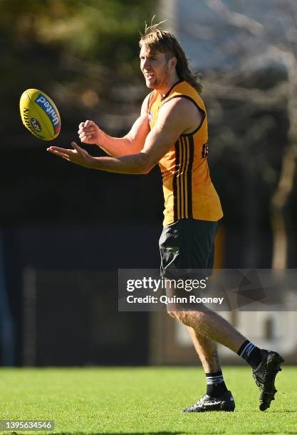 Max Lynch of the Hawks handballs during a Hawthorn Hawks AFL training session at Waverley Park on May 06, 2022 in Melbourne, Australia.