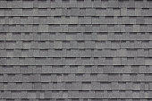 dark grey asphalt tiles decoration on house wall or roof. dark grey asphalt tiles decoration on house wall or roof.