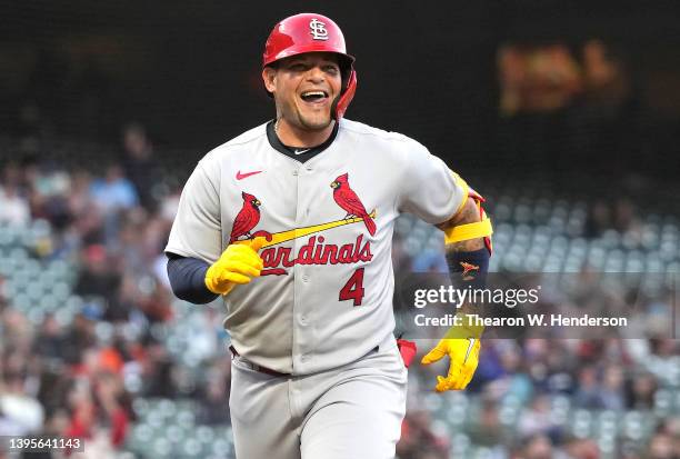 Yadier Molina of the St. Louis Cardinals reacts while trotting around the bases after hitting a solo home run against the San Francisco Giants in the...