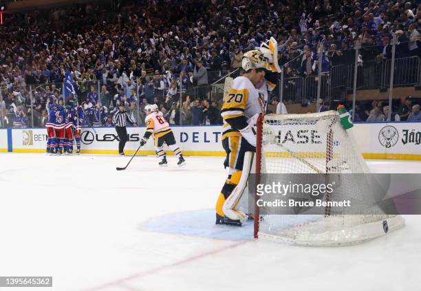 The New York Rangers celebrate a goal against Louis Domingue of the Pittsburgh Penguins in Game Two of the First Round of the 2022 Stanley Cup...