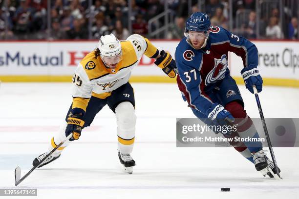 Compher of the Colorado Avalanche brings the puck down the ice against Matt Duchene of the Nashville Predators in the second period during Game Two...