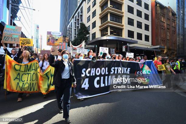 Climate activists march through the CBD during the 'School Strike 4 Climate' on May 06, 2022 in Sydney, Australia. Students are rallying ahead of the...