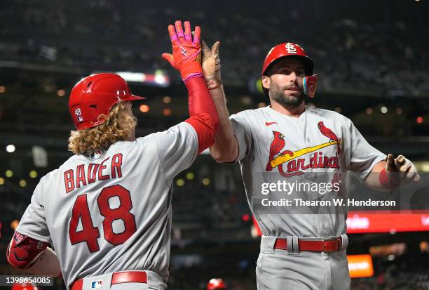 Paul Goldschmidt of the St. Louis Cardinals is congratulated by Harrison Bader after scoring against the San Francisco Giants in the top of the...