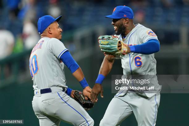 Eduardo Escobar and Starling Marte of the New York Mets celebrate their win against the Philadelphia Phillies at Citizens Bank Park on May 5, 2022 in...