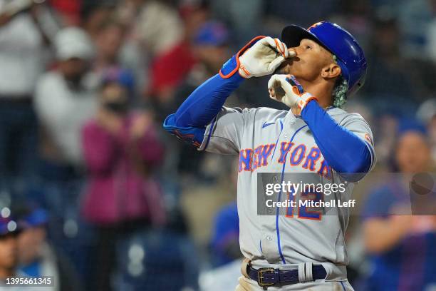 Francisco Lindor of the New York Mets reacts after hitting a two run home run in the top of the ninth inning against the Philadelphia Phillies at...