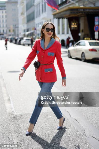 Influencer Alexandra Lapp wearing a pink and blue-grey colored vintage jacket by Chanel, medium blue colored denim jeans pants by Citizen of...