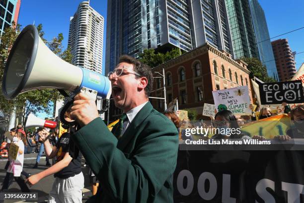 Climate activists march through the CBD during the 'School Strike 4 Climate' on May 06, 2022 in Sydney, Australia. Students are rallying ahead of the...