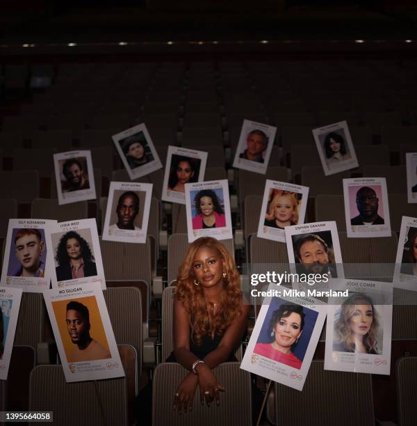 Zeze Millz poses with heads on sticks, which are used to arrange seat placings ahead of the Virgin Media British Academy Television Awards, at The...