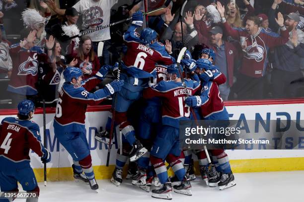 The Colorado Avalanche celebrate a goal by Cale Makar against the Nashville Predators in overtime during Game Two of the First Round of the 2022...