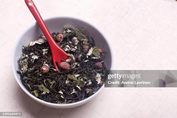 herbal tea in a gray bowl. epilobium with raspberries. blooming sally. - raspberry plant stock pictures, royalty-free photos & images