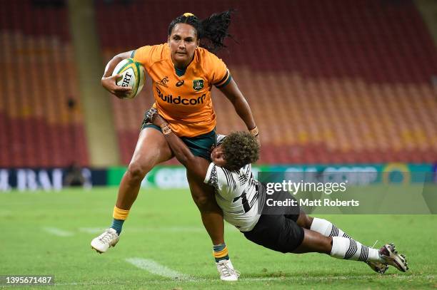 Mahalia Murphy of the Wallaroos breaks free of the tackle and scores a try during the Women's International Test match between the Australia...