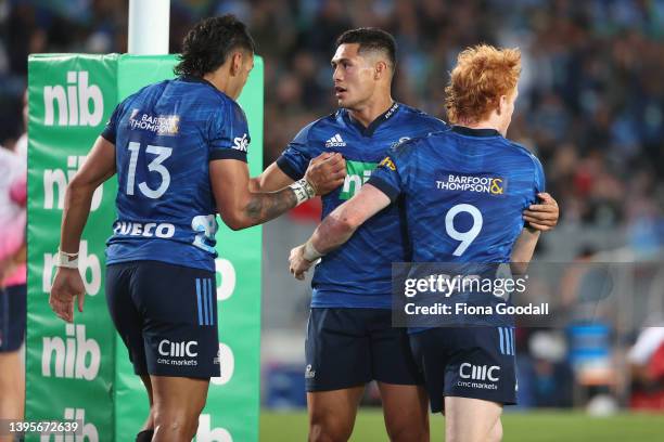 Roger Tuivasa-Shek of the Blues celebrates a try with Finlay Christie of the Blues and Rieko Ioane of the Blues (Lduring the round 12 Super Rugby...