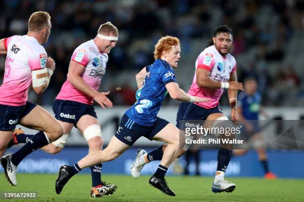 Finlay Christie of the Blues runs in to score a try during the round 12 Super Rugby Pacific match between the Blues and the Melbourne Rebels at Eden...