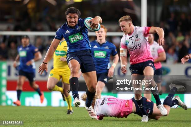 Caleb Clarke of the Blues makes a break during the round 12 Super Rugby Pacific match between the Blues and the Melbourne Rebels at Eden Park on May...