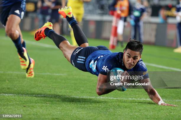 Rieko Ioane of the Blues scores a try during the round 12 Super Rugby Pacific match between the Blues and the Melbourne Rebels at Eden Park on May...