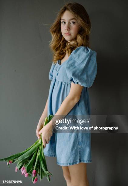 cute teeanger european girl 15 years old with tulips - 12 13 14 15 years girl stock pictures, royalty-free photos & images
