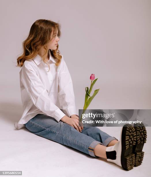 cute teenager girl 14-16 years old european school girl with tulips - 12 13 14 15 years girl stock pictures, royalty-free photos & images