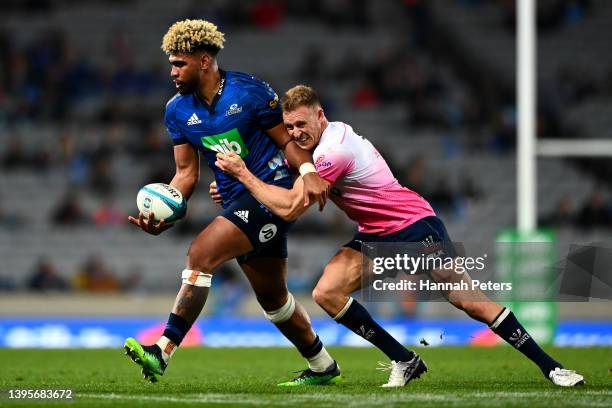 Hoskins Sotutu of the Blues charges forward during the round 12 Super Rugby Pacific match between the Blues and the Melbourne Rebels at Eden Park on...