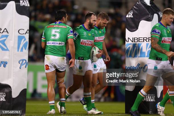 Matt Frawley of the Raiders is congratulated by team mates after scoring during the round nine NRL match between the Canberra Raiders and the...