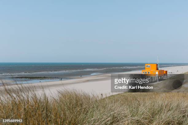 a daytime view of a beach in the netherlands - olanda settentrionale foto e immagini stock