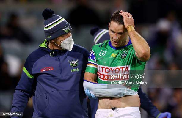 Jarrod Croker of the Raiders is taken from the field with an injury during the round nine NRL match between the Canberra Raiders and the Canterbury...
