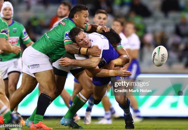 Josh Jackson of the Bulldogs offloads during the round nine NRL match between the Canberra Raiders and the Canterbury Bulldogs at GIO Stadium, on May...