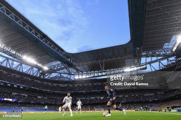 Joao Cancelo of Manchester City FC competes for the ball with Dani Carvajal of Real Madrid CF during the UEFA Champions League Semi Final Leg Two...