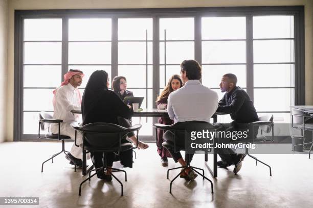middle eastern businesspeople discussing project plans - middle east stock pictures, royalty-free photos & images