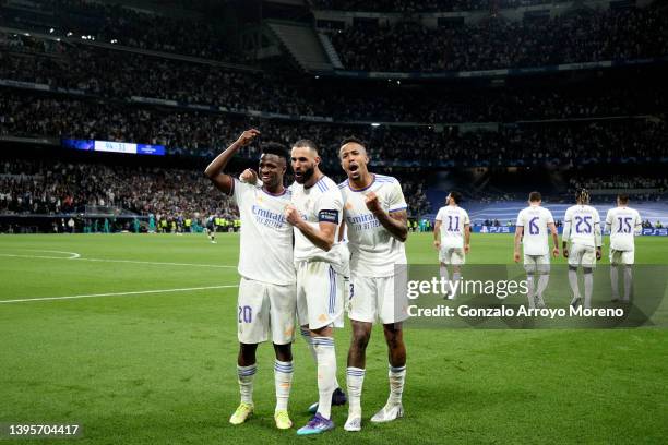 Karim Benzema of Real Madrid CF celebrates scoring their third goal with teammates Vinicius Junior and Eder Gabriel Militao during the UEFA Champions...