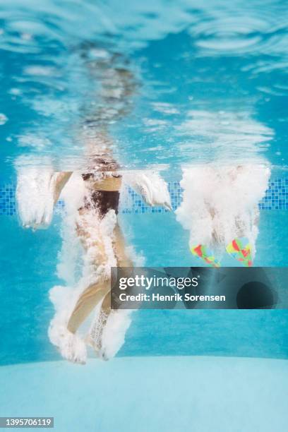 girls in swimming pool - diving flipper stock pictures, royalty-free photos & images