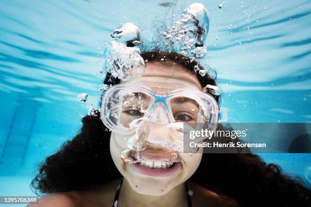 girl in swimming pool - 14 year old biracial girl curly hair stock pictures, royalty-free photos & images