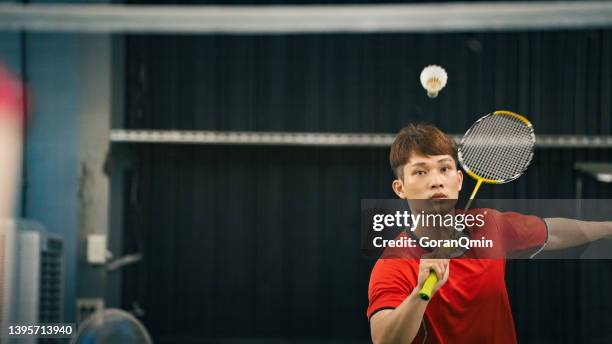 《badminton spirit》mixed doubles practicing driven flight - badminton smash stock pictures, royalty-free photos & images