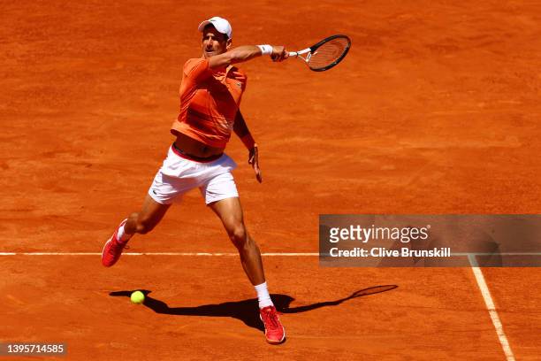 Novak Djokovic of Serbia plays a forehand in their quarter-final match against Hubert Hurkacz of Poland during day nine of Mutua Madrid Open at La...