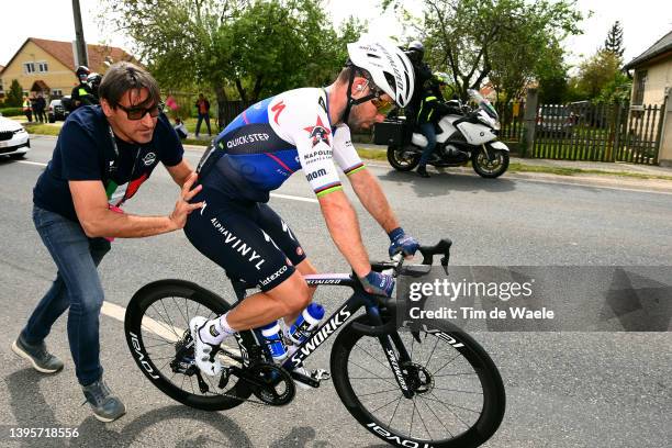 Davide Bramati Sports Director helps to Mark Cavendish of United Kingdom and Team Quick-Step - Alpha Vinyl after a mechanical problem during the...