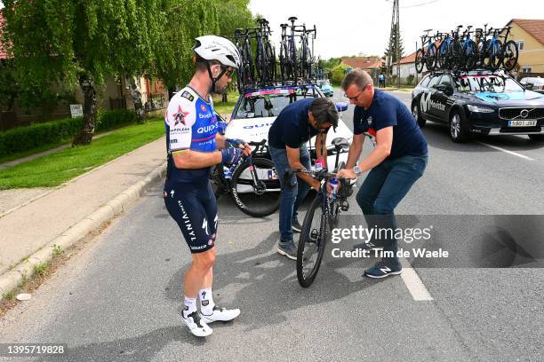 Davide Bramati Sports Director and Kurt Roose of Belgium Mechanic help to Mark Cavendish of United Kingdom and Team Quick-Step - Alpha Vinyl after a...