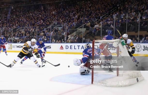 Sidney Crosby of the Pittsburgh Penguins scores on Igor Shesterkin of the New York Rangers 2022 Stanley Cup Playoffs at Madison Square Garden on May...