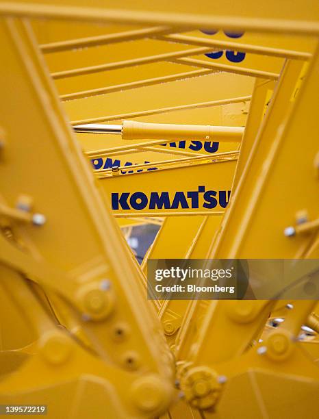 Komatsu Ltd. Excavators bound for shipment sit at the company's plant in Hirakata City, Osaka, Japan, on Thursday, Feb. 23, 2012. Komatsu Ltd. Is the...