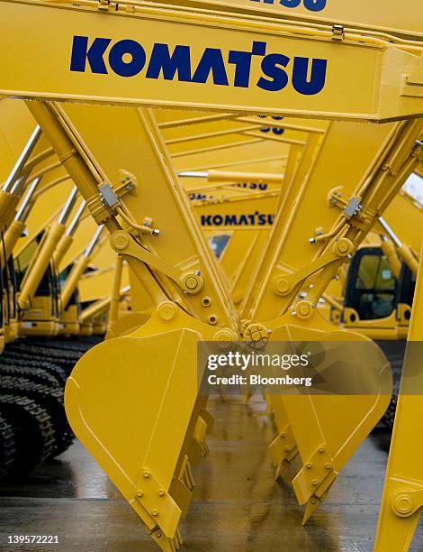 Komatsu Ltd. Excavators bound for shipment sit at the company's plant in Hirakata City, Osaka, Japan, on Thursday, Feb. 23, 2012. Komatsu Ltd. Is the...