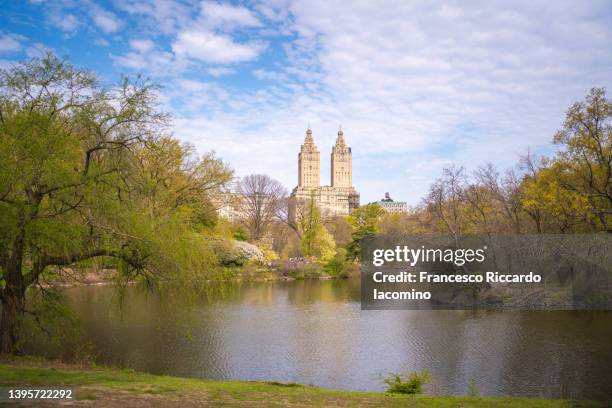 new york city, manhattan, central park, lake and upper west side buildings in springtime - park city background stock pictures, royalty-free photos & images