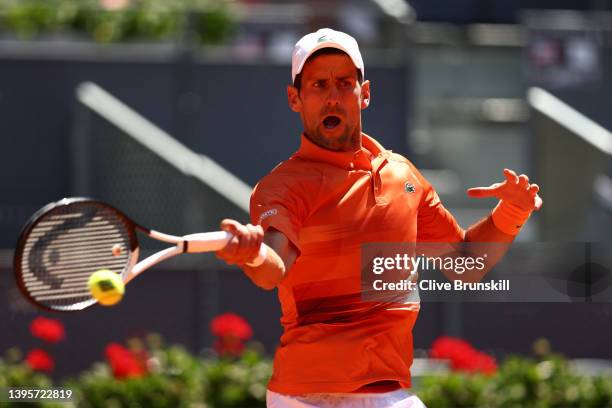 Novak Djokovic of Serbia plays a forehand in their quarter-final match against Hubert Hurkacz of Poland during day nine of Mutua Madrid Open at La...