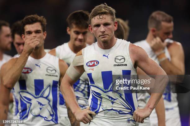 Jack Ziebell of the Kangaroos leads the team from the field after being defeated during the round eight AFL match between the Fremantle Dockers and...