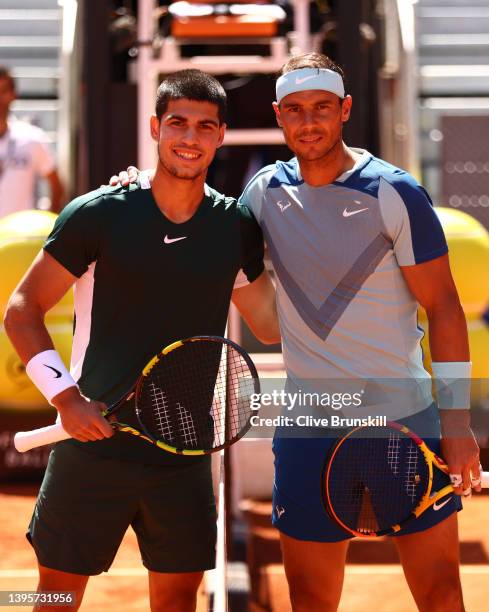 Carlos Alcaraz Garfia of Spain and Rafael Nadal of Spain pose for a photo ahead of their quarter-final match during day nine of Mutua Madrid Open at...