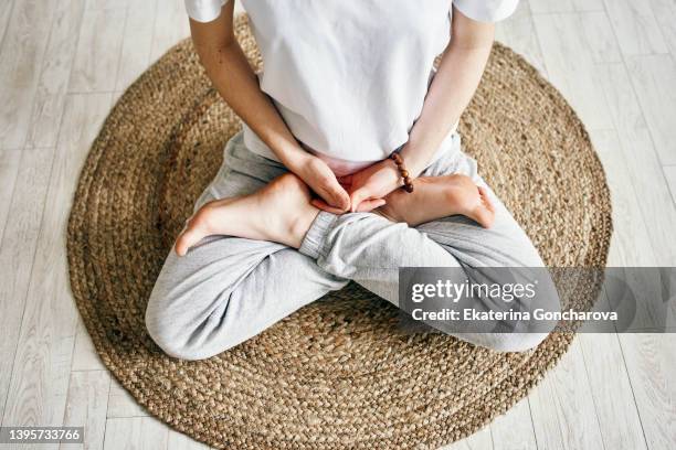 close up of woman practicing breathing exercise and meditating. - practice stock-fotos und bilder