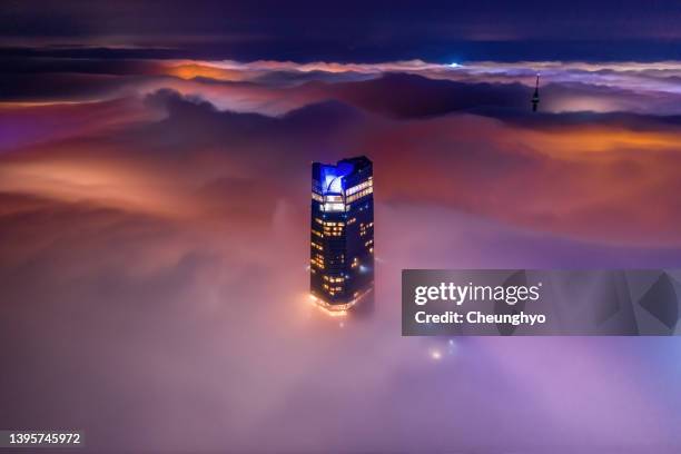 local landmark of qingdao cityscape in the mist, qingdao city, shandong province, china - aerial view clouds stock pictures, royalty-free photos & images