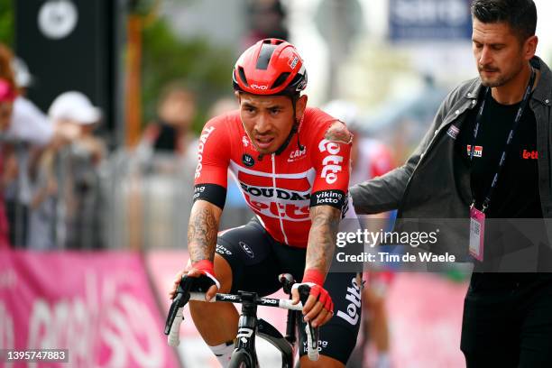 Caleb Ewan of Australia and Team Lotto Soudal crosses the finish line injured after being involved in a crash during the 105th Giro d'Italia 2022,...