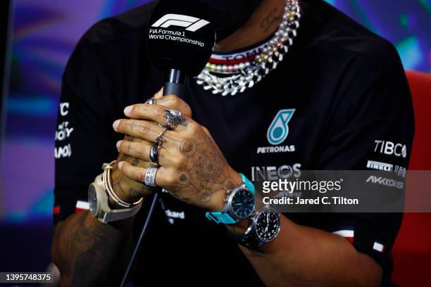 Detail shot of the jewellery of Lewis Hamilton of Great Britain and Mercedes in the Drivers Press Conference prior to practice ahead of the F1 Grand...